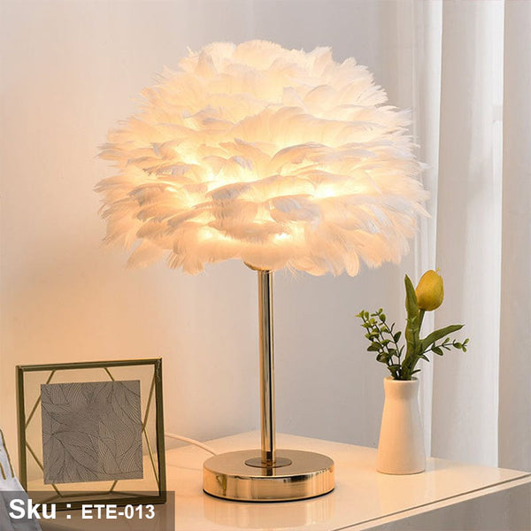 Gold stainless steel lamp with a small circular shade made of natural feathers, off-white color - ETE-013